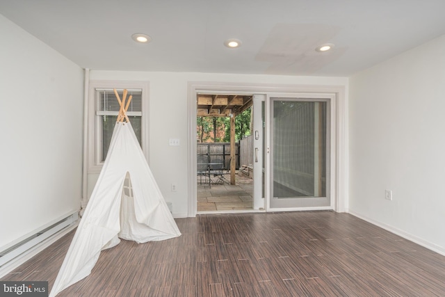 3709 Jocelyn St NW, Washington, DC 20015 - unfurnished room featuring a baseboard heating unit, recessed lighting, wood finished floors, and baseboards