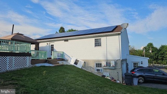 1300 River Rd, Holtwood, PA 17532 - rear view of house featuring solar panels, a gazebo, and a lawn