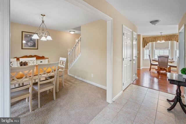1219 N Valley Ave, Vineland, NJ 08360 - dining room with a chandelier, light tile patterned flooring, baseboards, and stairs