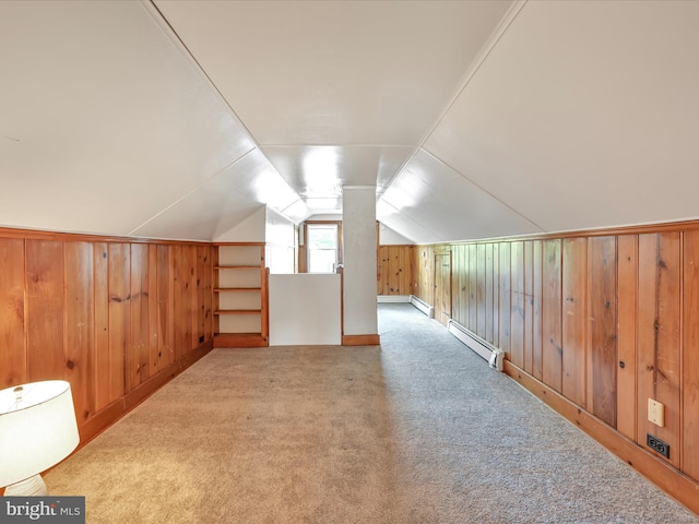 135 Hoover St, Schuylkill Haven, PA 17972 - additional living space with a baseboard radiator, wooden walls, carpet floors, and vaulted ceiling