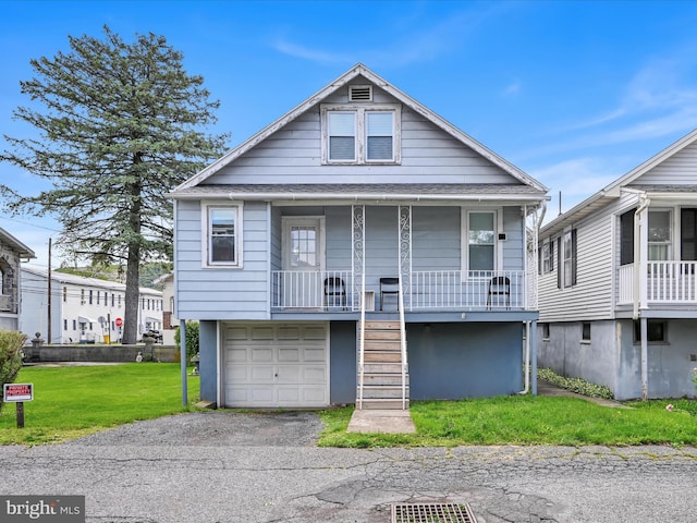 135 Hoover St, Schuylkill Haven, PA 17972 - view of front of property with stairs, a porch, a front lawn, a garage, and asphalt driveway