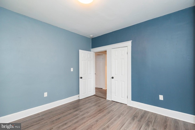 3327 Richmond Ave, Baltimore, MD 21213 - unfurnished bedroom featuring wood finished floors and baseboards