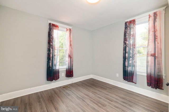 3327 Richmond Ave, Baltimore, MD 21213 - spare room with baseboards, wood finished floors, and plenty of natural light