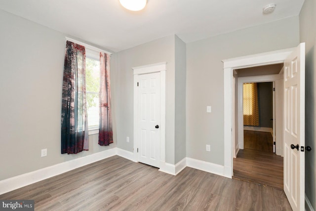 3327 Richmond Ave, Baltimore, MD 21213 - unfurnished bedroom with wood finished floors and baseboards