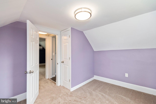 3327 Richmond Ave, Baltimore, MD 21213 - additional living space with light carpet, lofted ceiling, and baseboards