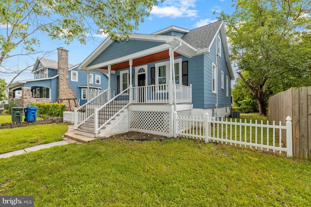 3327 Richmond Ave, Baltimore, MD 21213 - bungalow with a porch, roof with shingles, central AC unit, and stairway