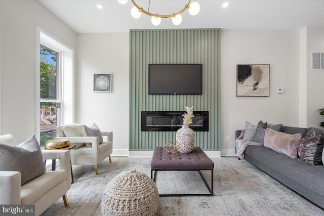 724 E 21st St, Baltimore, MD 21218 - living room featuring a chandelier, baseboards, and recessed lighting