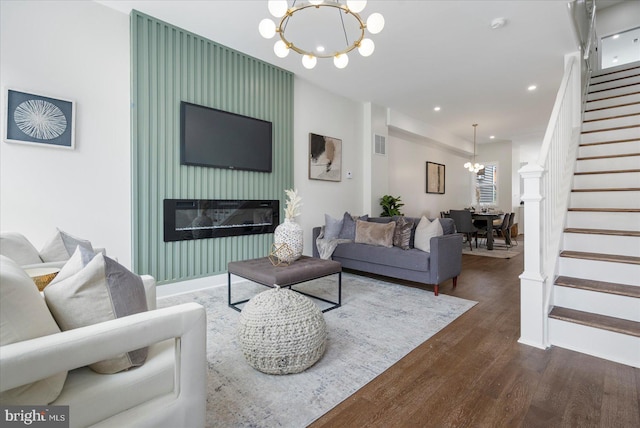 724 E 21st St, Baltimore, MD 21218 - living area with a chandelier, stairway, dark wood-style floors, recessed lighting, and a fireplace
