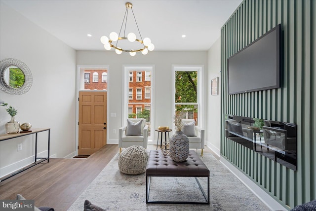 724 E 21st St, Baltimore, MD 21218 - living area featuring wood finished floors, a chandelier, baseboards, and recessed lighting