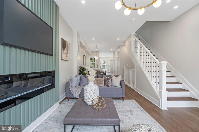724 E 21st St, Baltimore, MD 21218 - living area with stairway, wood finished floors, baseboards, a chandelier, and recessed lighting