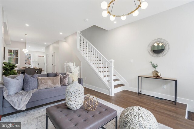 724 E 21st St, Baltimore, MD 21218 - living area featuring a chandelier, wood finished floors, stairway, baseboards, and recessed lighting