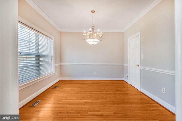 8524 Schultz Rd, Clinton, MD 20735 - unfurnished room with a chandelier, ornamental molding, light wood finished floors, and baseboards