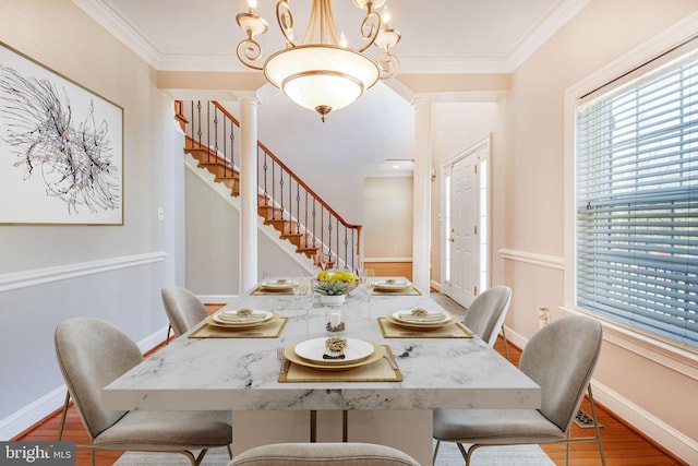 8524 Schultz Rd, Clinton, MD 20735 - dining space with stairs, baseboards, crown molding, a chandelier, and decorative columns