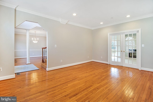 8524 Schultz Rd, Clinton, MD 20735 - empty room featuring light wood-style floors, ornamental molding, baseboards, arched walkways, and recessed lighting