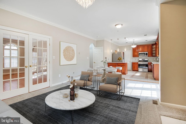8524 Schultz Rd, Clinton, MD 20735 - living area with light carpet, crown molding, baseboards, french doors, and a chandelier