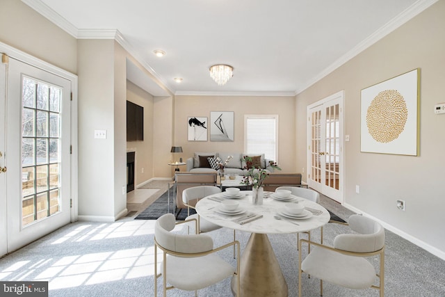 8524 Schultz Rd, Clinton, MD 20735 - carpeted dining area with a fireplace with flush hearth, ornamental molding, baseboards, french doors, and a chandelier