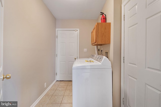 8524 Schultz Rd, Clinton, MD 20735 - laundry room with cabinet space, washing machine and dryer, light tile patterned flooring, and baseboards