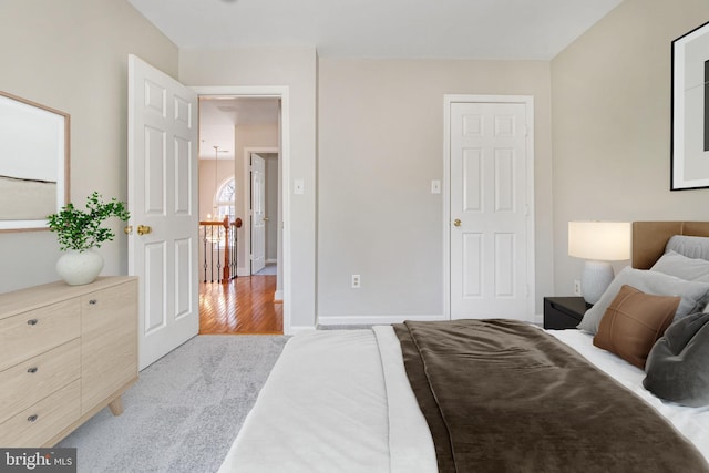 8524 Schultz Rd, Clinton, MD 20735 - bedroom with light carpet, baseboards, and light wood finished floors