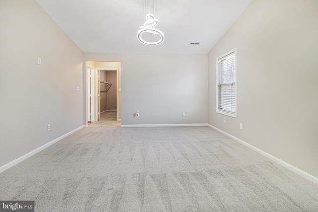 8524 Schultz Rd, Clinton, MD 20735 - carpeted empty room featuring baseboards and a chandelier