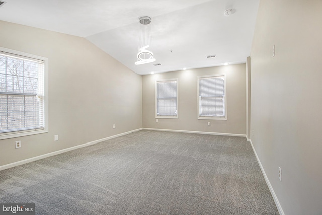 8524 Schultz Rd, Clinton, MD 20735 - carpeted empty room with plenty of natural light, baseboards, vaulted ceiling, and a chandelier
