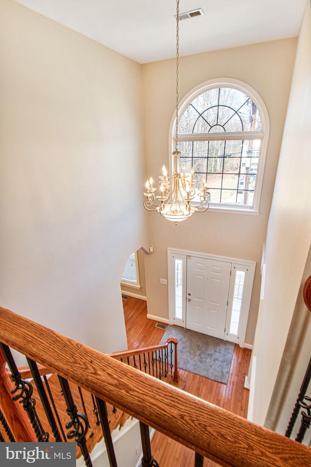 8524 Schultz Rd, Clinton, MD 20735 - foyer entrance with wood finished floors, a chandelier, and baseboards