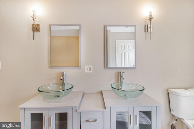 8524 Schultz Rd, Clinton, MD 20735 - bathroom featuring double vanity and toilet
