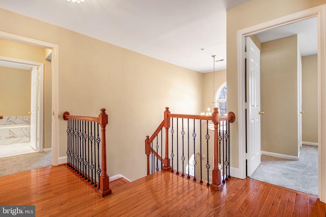 8524 Schultz Rd, Clinton, MD 20735 - staircase featuring hardwood / wood-style flooring, baseboards, and carpet floors