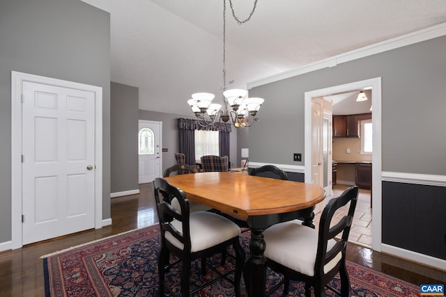 716 Preddy Creek Rd, Barboursville, VA 22923 - dining area featuring a chandelier, vaulted ceiling, wood finished floors, and baseboards