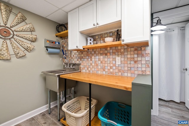 716 Preddy Creek Rd, Barboursville, VA 22923 - kitchen featuring open shelves, a paneled ceiling, butcher block countertops, and wood finished floors