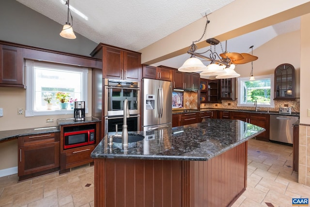 716 Preddy Creek Rd, Barboursville, VA 22923 - kitchen featuring stainless steel appliances, lofted ceiling, a sink, decorative backsplash, and stone tile flooring