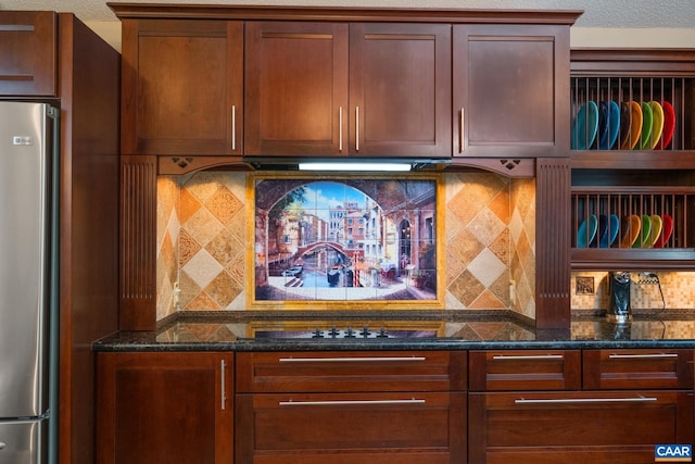 716 Preddy Creek Rd, Barboursville, VA 22923 - kitchen view of freestanding refrigerator, dark stone countertops, backsplash, and black electric stovetop