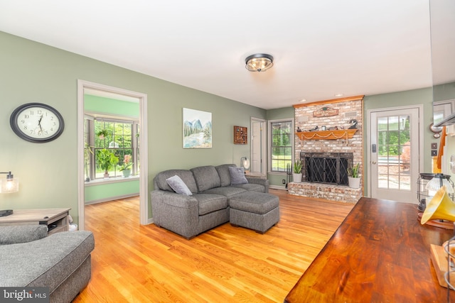 3532 Tall Pines Ln, Snow Hill, MD 21863 - living area featuring wood finished floors, a fireplace, plenty of natural light, and baseboards