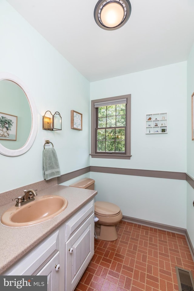 3532 Tall Pines Ln, Snow Hill, MD 21863 - bathroom featuring toilet, brick patterned floors, vanity, and baseboards