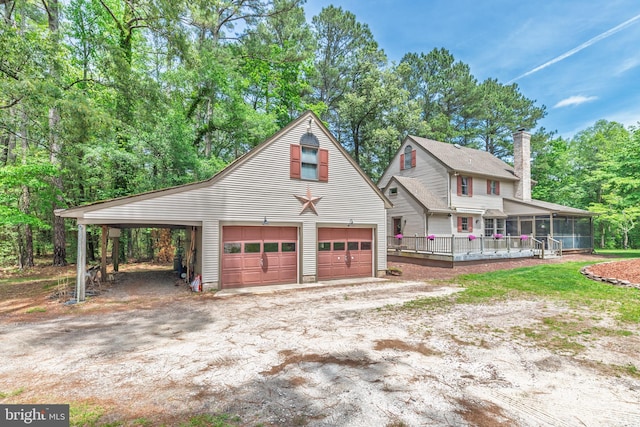 3532 Tall Pines Ln, Snow Hill, MD 21863 - view of front of property with a detached garage, a sunroom, a chimney, and an outdoor structure
