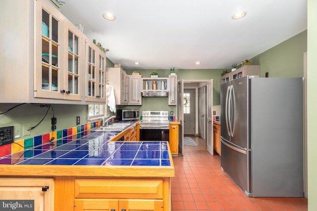3532 Tall Pines Ln, Snow Hill, MD 21863 - kitchen with appliances with stainless steel finishes, tile patterned floors, recessed lighting, a peninsula, and a sink