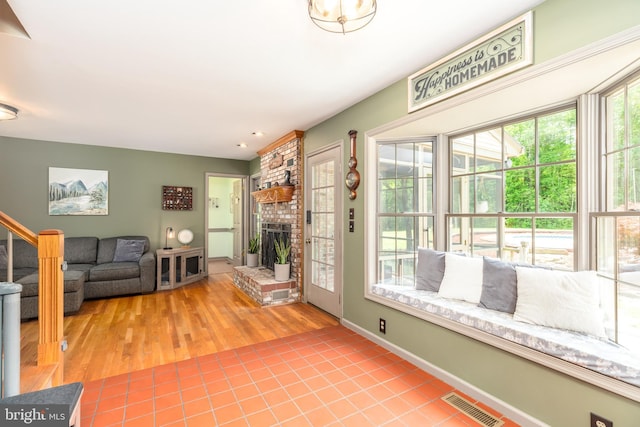 3532 Tall Pines Ln, Snow Hill, MD 21863 - living area with a fireplace, wood finished floors, and baseboards