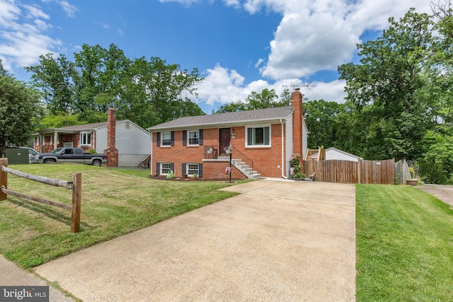 1704 Horner Rd, Woodbridge, VA 22191 - view of front of home with a chimney, driveway, and brick siding