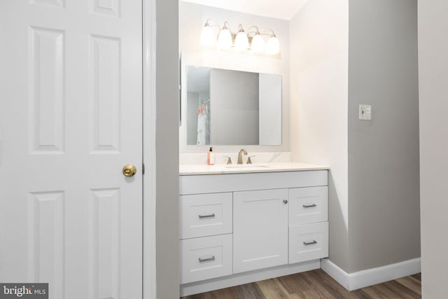 1704 Horner Rd, Woodbridge, VA 22191 - bathroom with vanity, baseboards, and wood finished floors