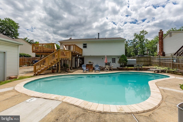 1704 Horner Rd, Woodbridge, VA 22191 - view of pool featuring stairway, a patio area, a deck, a fenced backyard, and a diving board