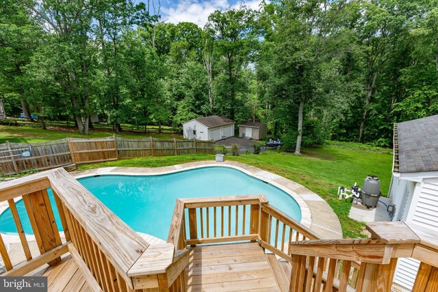 1704 Horner Rd, Woodbridge, VA 22191 - view of pool with view of scattered trees, a wooden deck, and an outbuilding