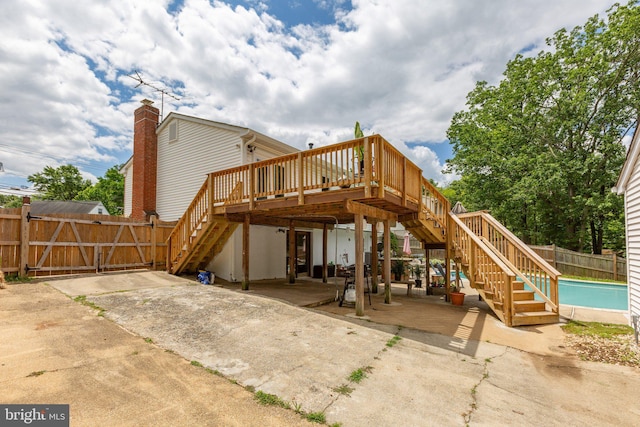 1704 Horner Rd, Woodbridge, VA 22191 - back of property with stairway, a patio area, a deck, and a fenced backyard