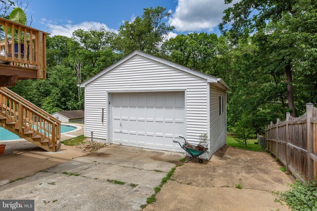 1704 Horner Rd, Woodbridge, VA 22191 - detached garage featuring view of wooded area