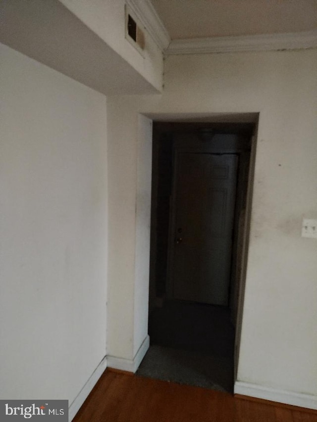 4202 Grant St NE Unit 202, Washington, DC 20019 - hall with crown molding, wood finished floors, and baseboards