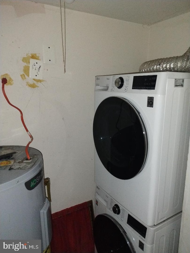 4202 Grant St NE Unit 202, Washington, DC 20019 - laundry room with water heater and stacked washing machine and dryer