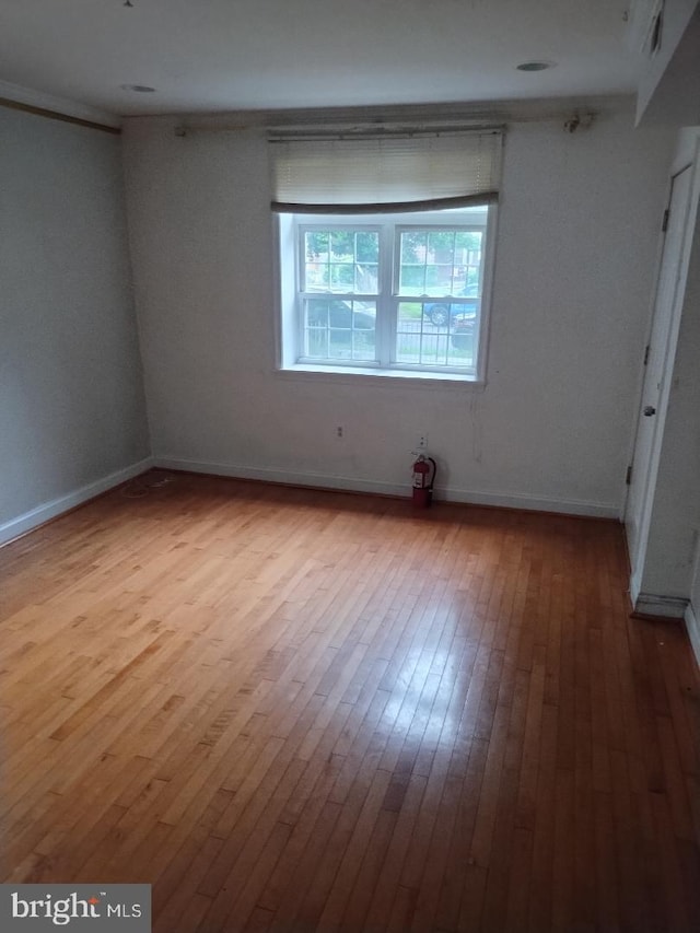 4202 Grant St NE Unit 202, Washington, DC 20019 - unfurnished bedroom featuring hardwood / wood-style floors and baseboards