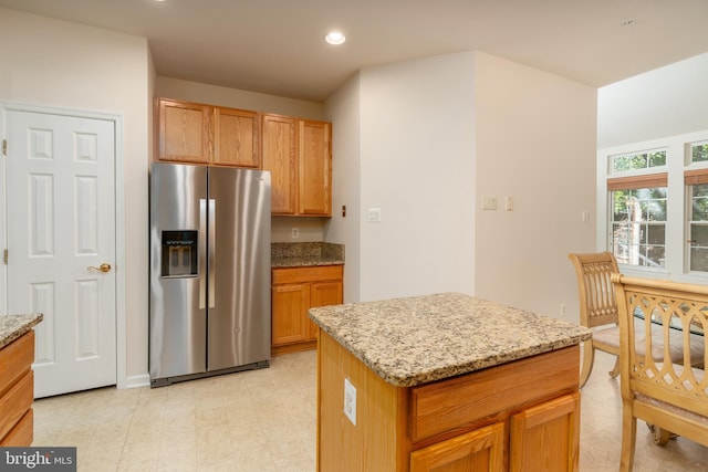 1908 Golden Morning Dr Unit 38, Bowie, MD 20721 - kitchen featuring stainless steel refrigerator with ice dispenser, light stone countertops, recessed lighting, a kitchen island, and light floors