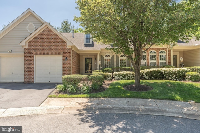 1908 Golden Morning Dr Unit 38, Bowie, MD 20721 - view of front facade featuring brick siding, driveway, an attached garage, and a front lawn