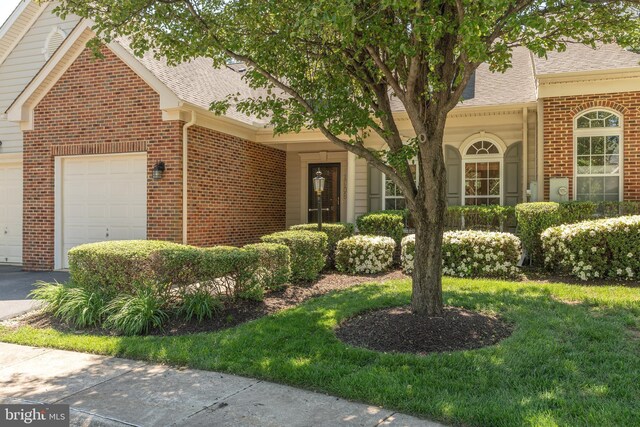1908 Golden Morning Dr Unit 38, Bowie, MD 20721 - view of front of property with a shingled roof, brick siding, and an attached garage