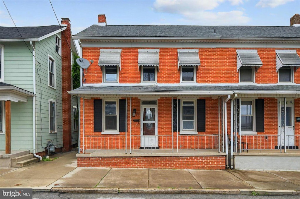 19 S Water St, Spring Grove, PA 17362 - view of front of home featuring brick siding and covered porch