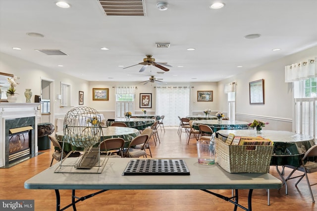 649 Brandon Rd, Eagleville, PA 19403 - dining space featuring a fireplace, wood finished floors, ceiling fan, and recessed lighting
